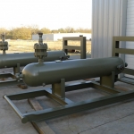 5800lb P.S.I. Sand Separator mounted on engineered L-shaped skid, inlet & outlet nozzles to customer request